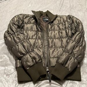 A ladies North face puffer jacket waist length size small